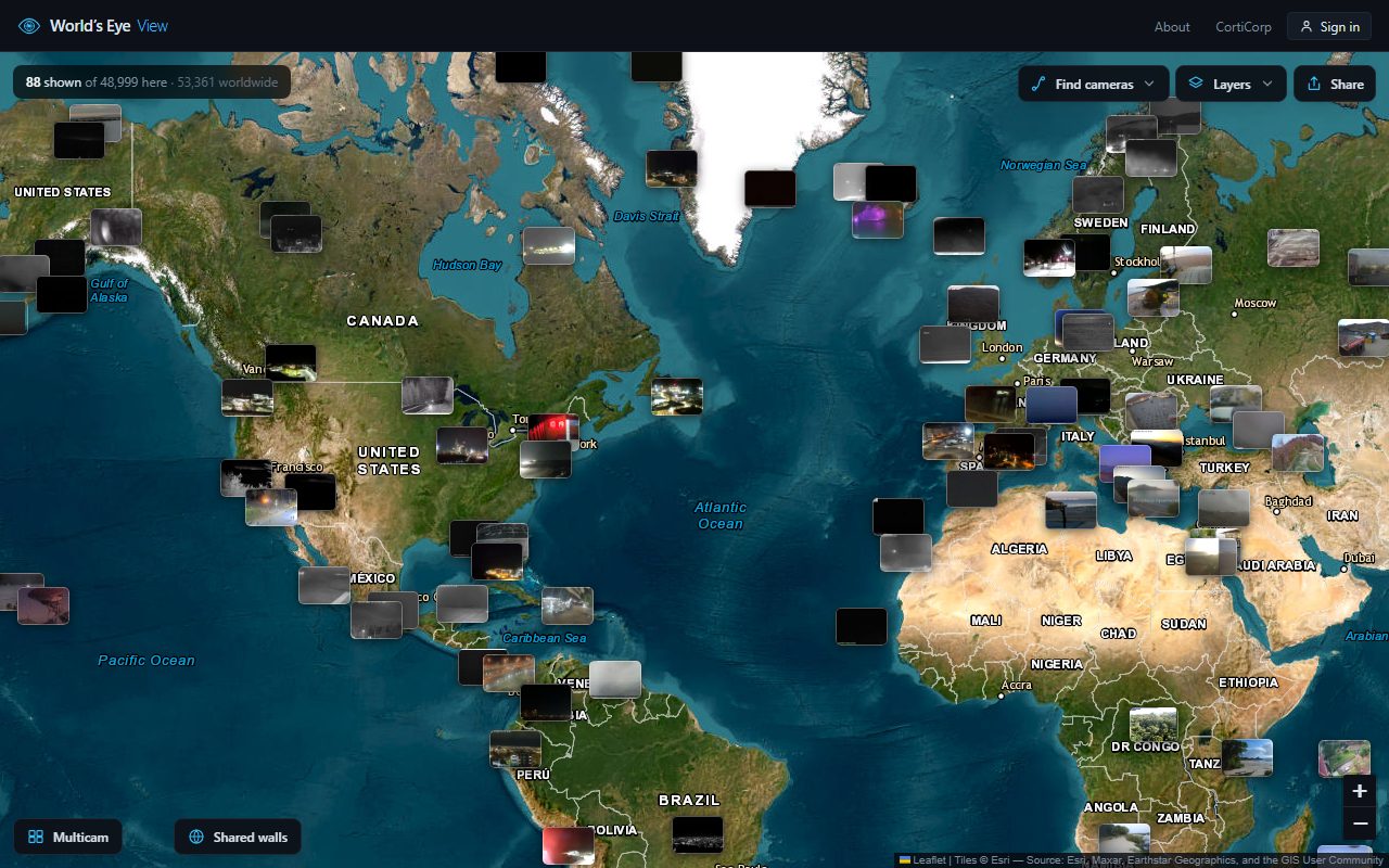 World's Eye View zoomed out over the Atlantic, live webcam thumbnails on a satellite map and a counter reading 53,361 cameras worldwide
