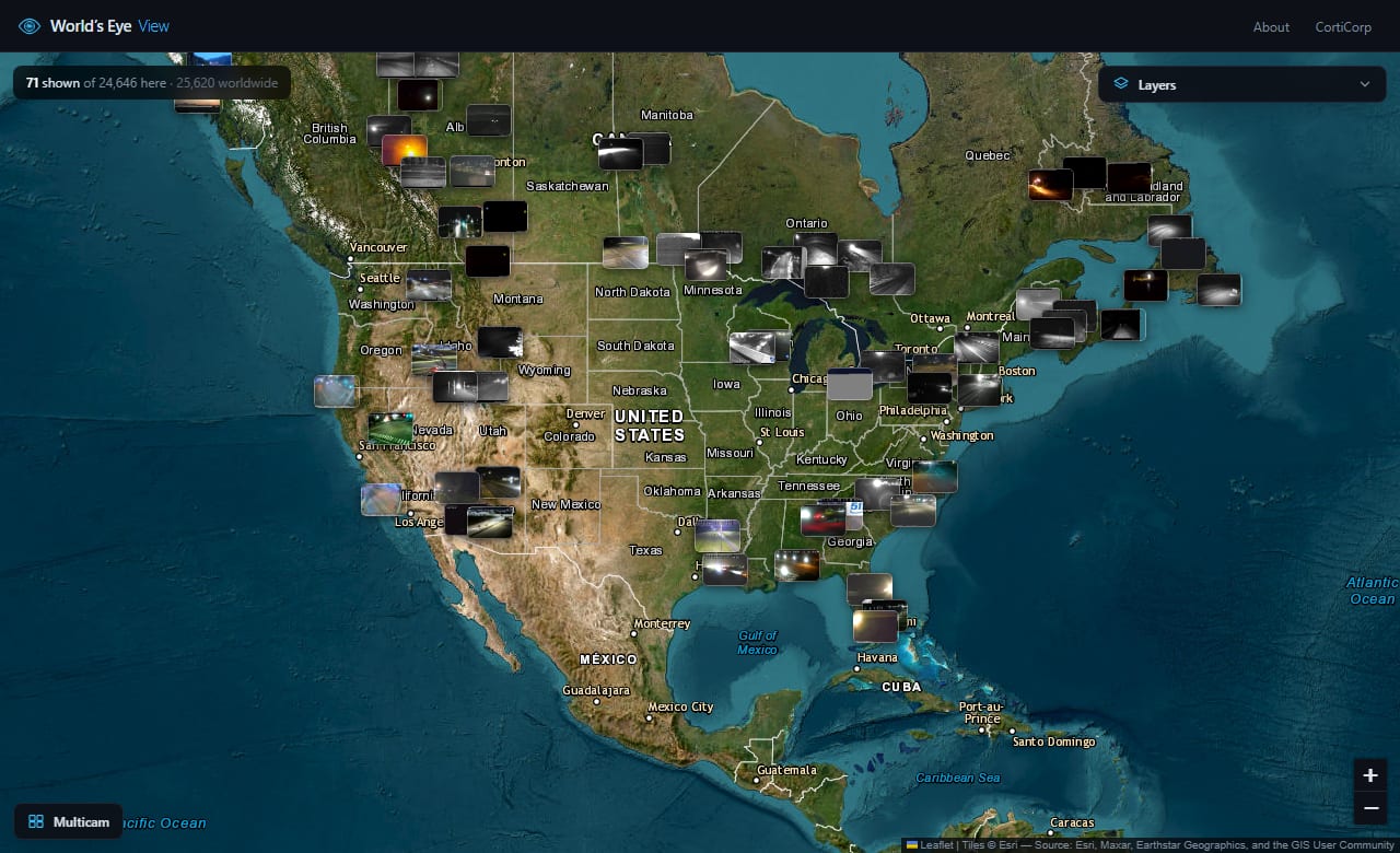 World's Eye View at continental zoom, live webcam thumbnails scattered across a satellite map of North America